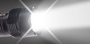 Flashlights shining.